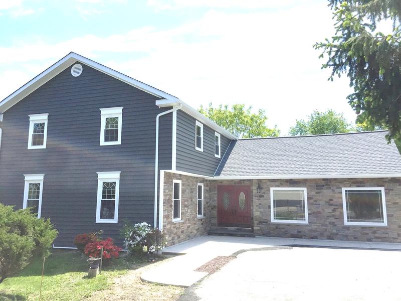 bottom half of home with stone veneer
